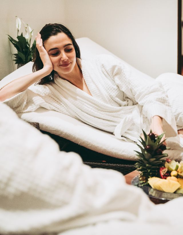 Woman relaxing in spa robes