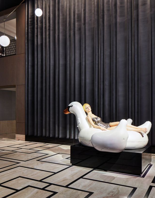 Lobby area with statue of woman on swan