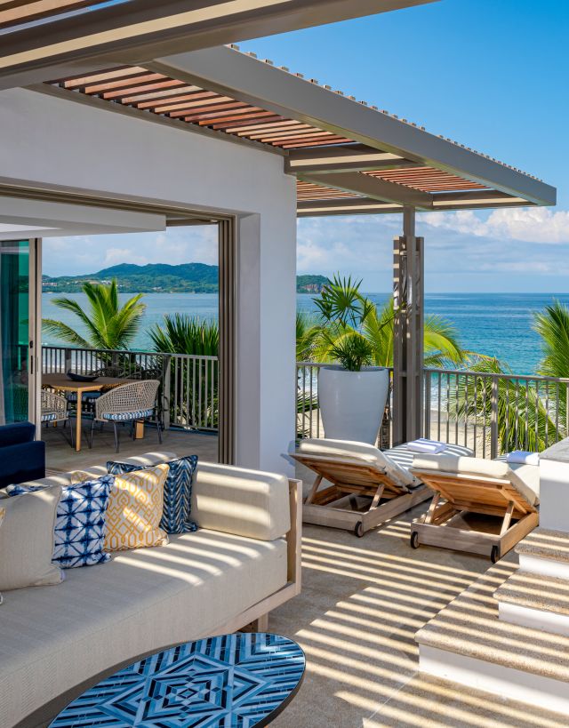 Grand Suite Terrace with Seating Area by the Pool Offering Ocean View