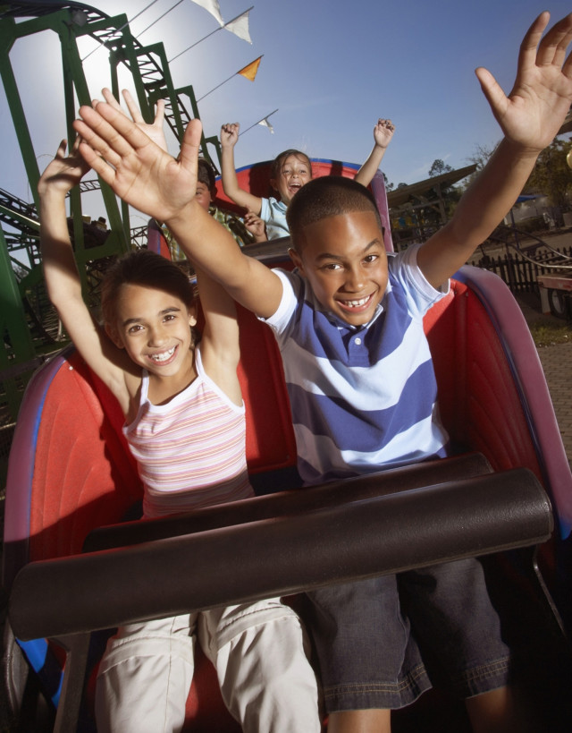 Kids Riding A Roller Coaster