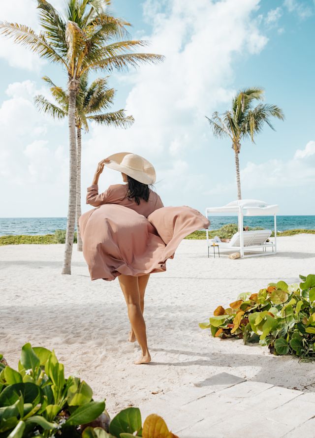 Woman walking on beach