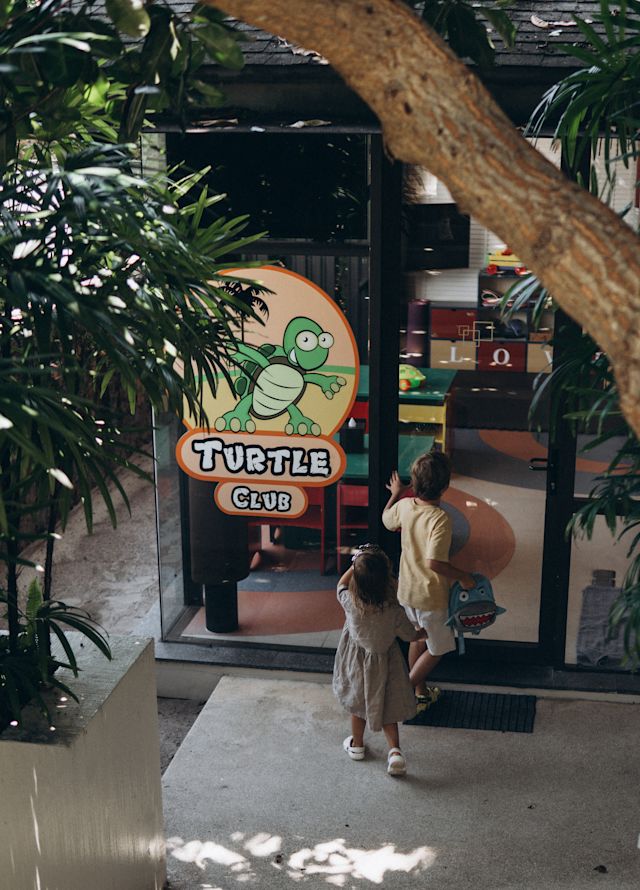 Mother and Daughter Entering the Turtle Club for Kids