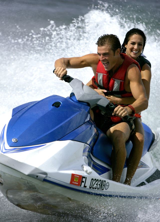 guests riding on a jet ski
