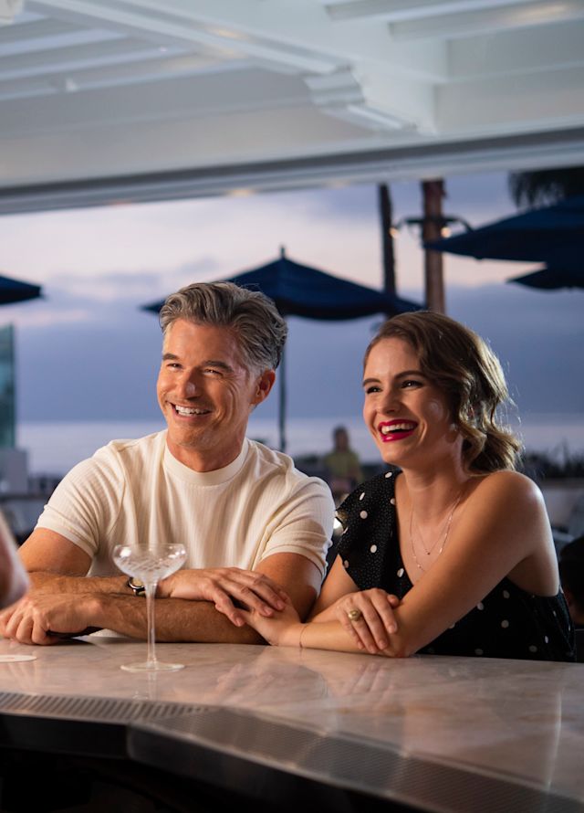 Couple at Bar watching waiter create drink