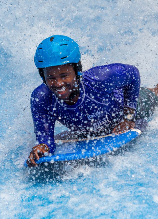 Man on sur board in waves