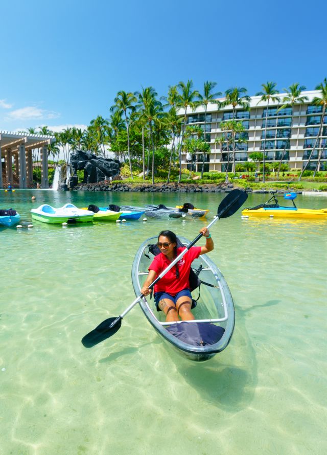Girl kayaking in lagoon