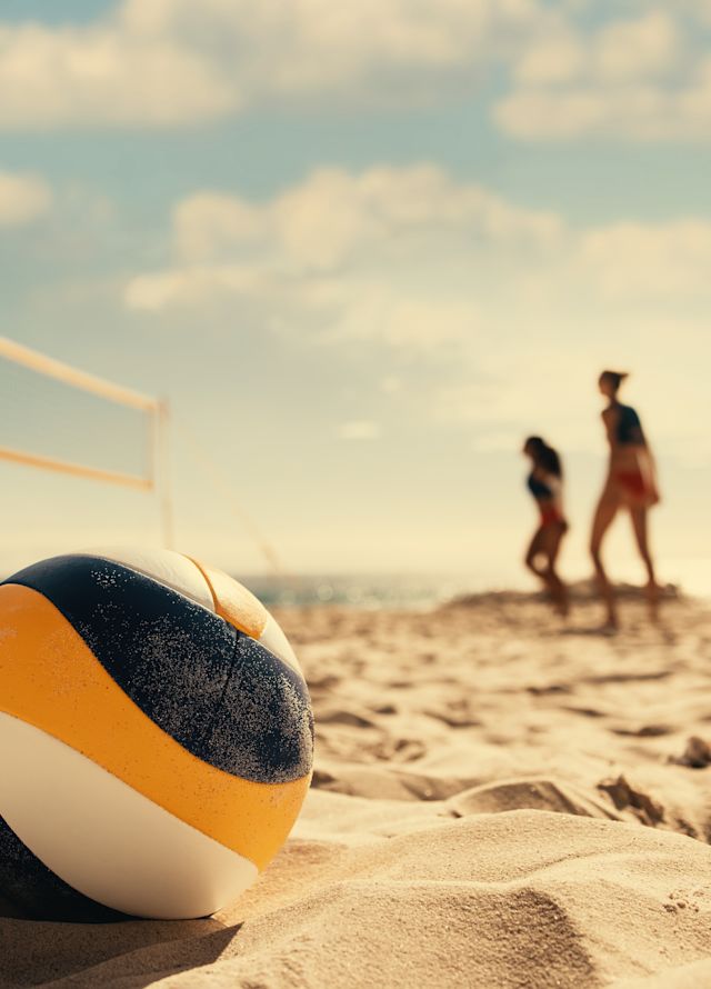 ビーチでのバレーボールと舞台裏のセッティング