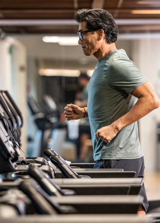 Man on treadmill in the fitness center.