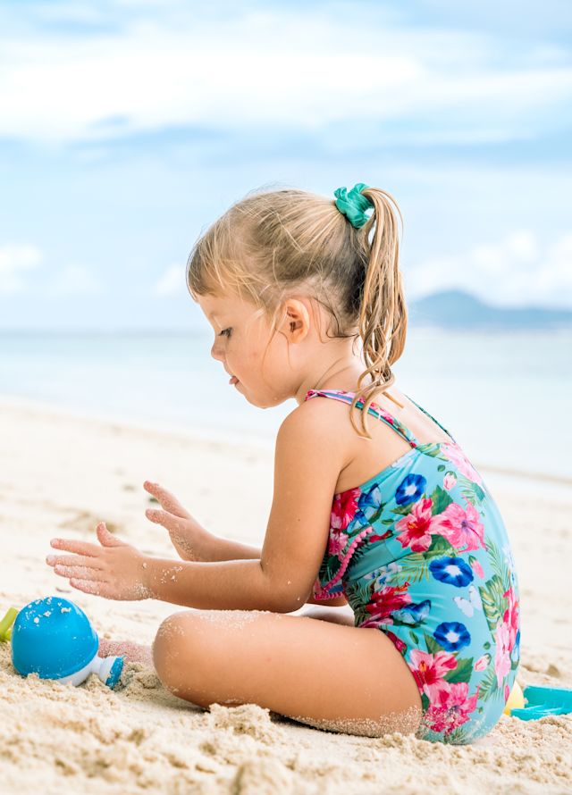 Girls Playing with Sand at the Beach