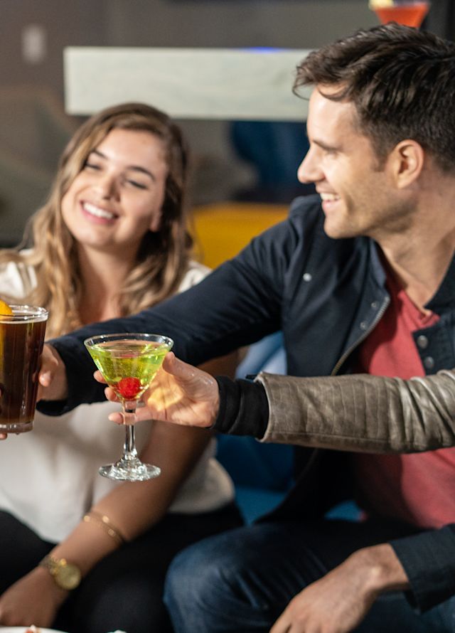 Group of friends raising their glasses