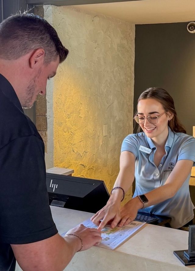 Hotel concierge speaking with guest