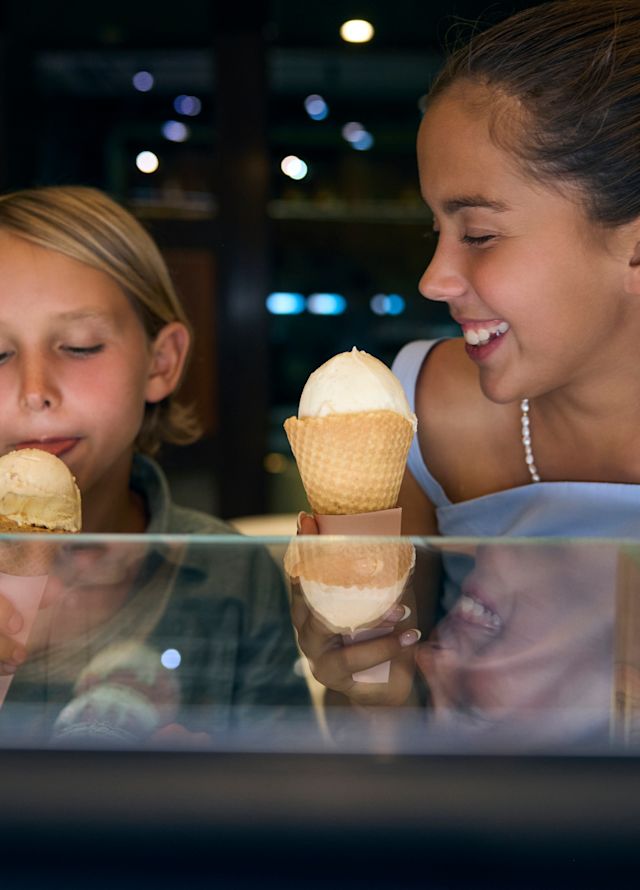 Two Girls Having Ice Cream Cones at Copo y Cono Restaurant