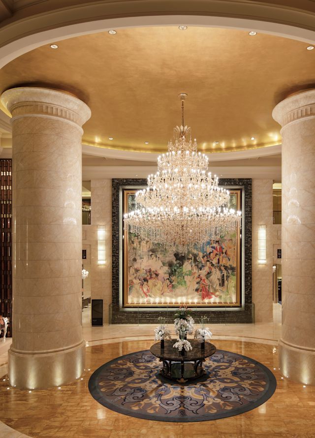 Lobby area with columns and chandelier
