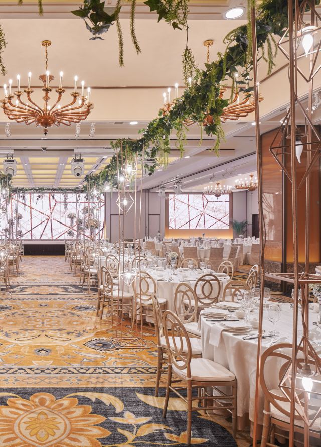 Royal Pavilion Ballroom setup for a wedding reception with a Infinite Love theme