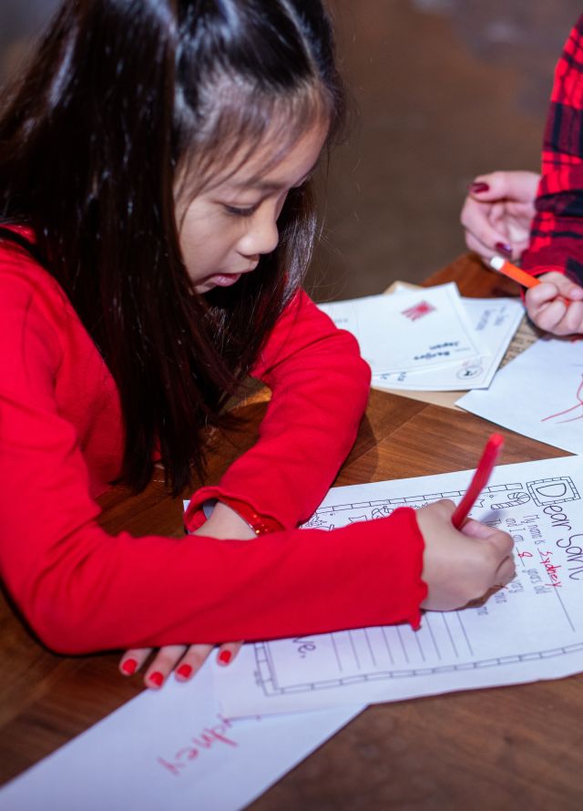 little girl writing
