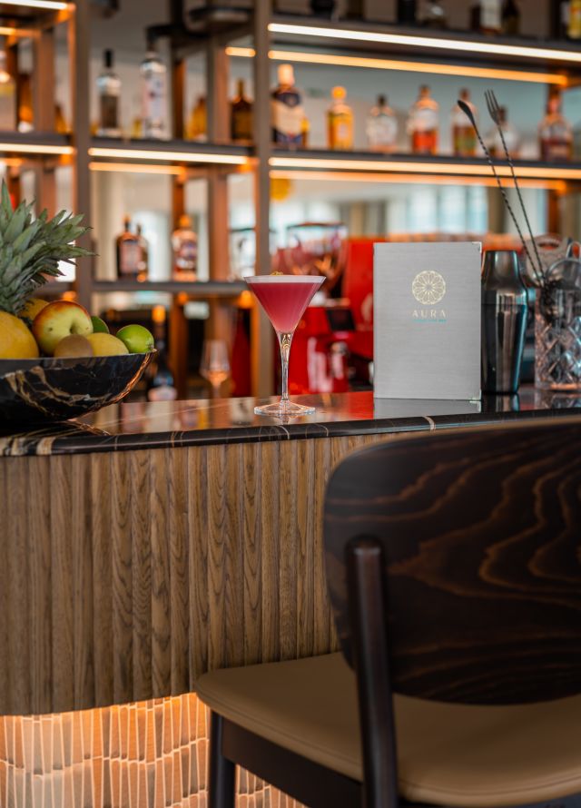 Longe bar image with cocktail and menu at bar