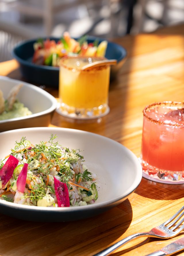 Salads and Drinks on a Table at the Pool Bar