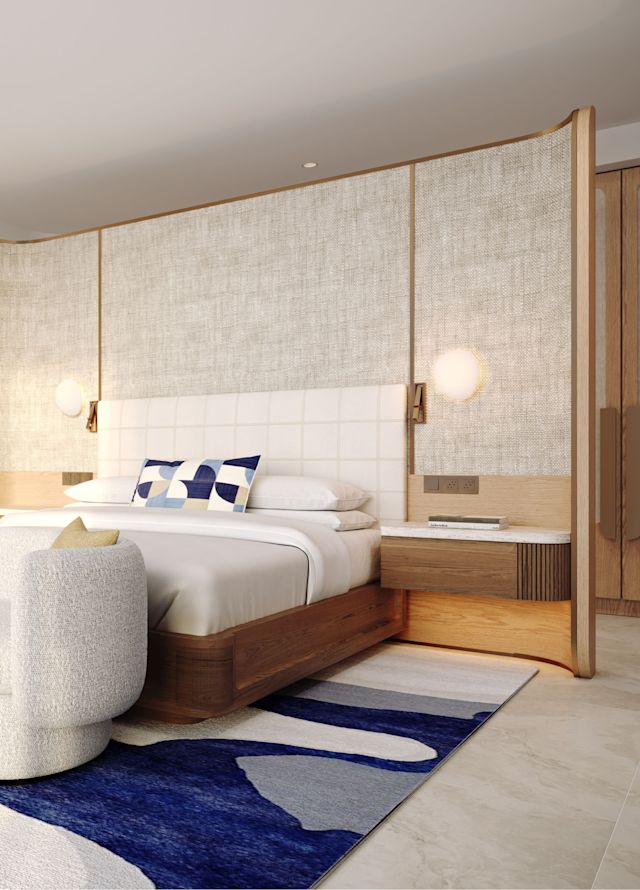 Bedroom with lounge in the background