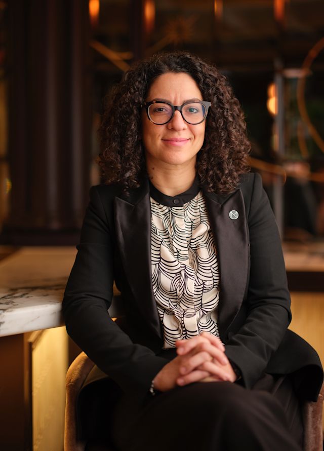 Headshot showing staff member smiling and facing camera