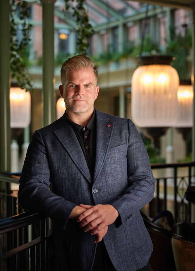 Headshot showing staff member smiling and facing camera