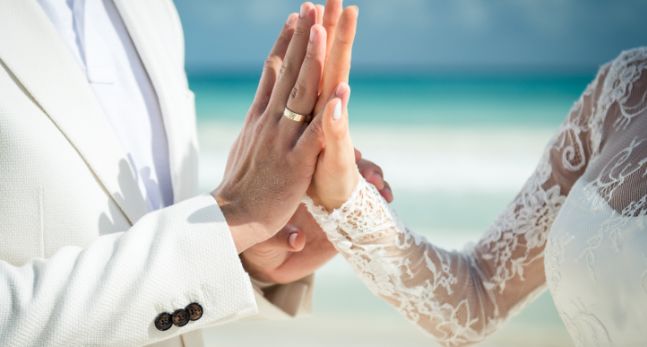 wedding couple touching hands