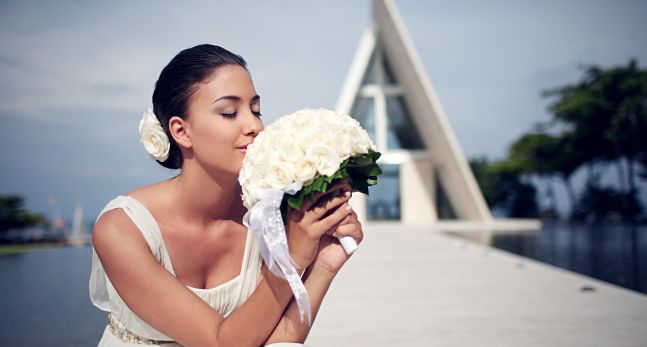 Bride with Bouquet in Front of Church