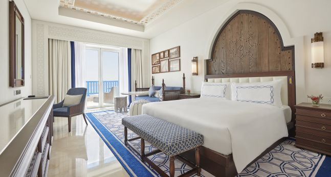 Bed in room with chair