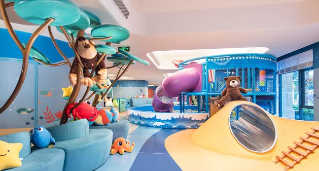 Kids Game Room with Stuffed Animals and Slide