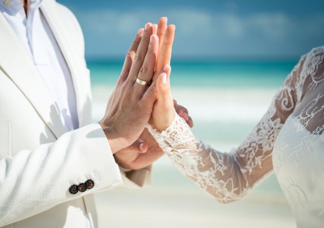 wedding couple touching hands