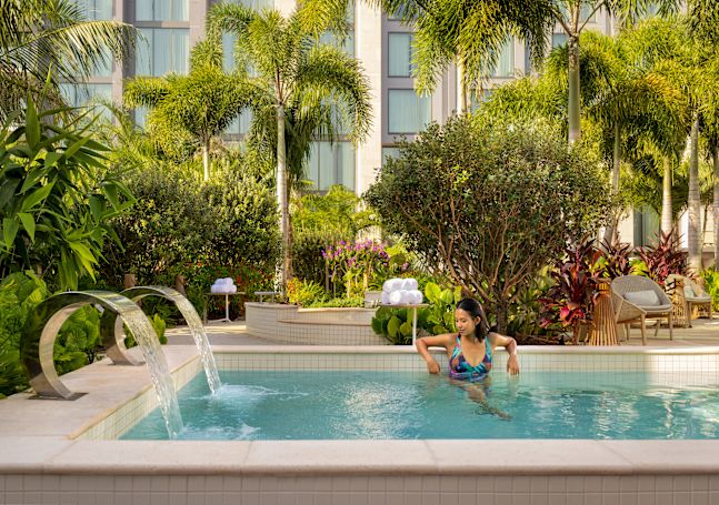guest sitting in the water garden pool
