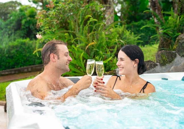 a Couple Enjoying Drinks in a Hot Tub