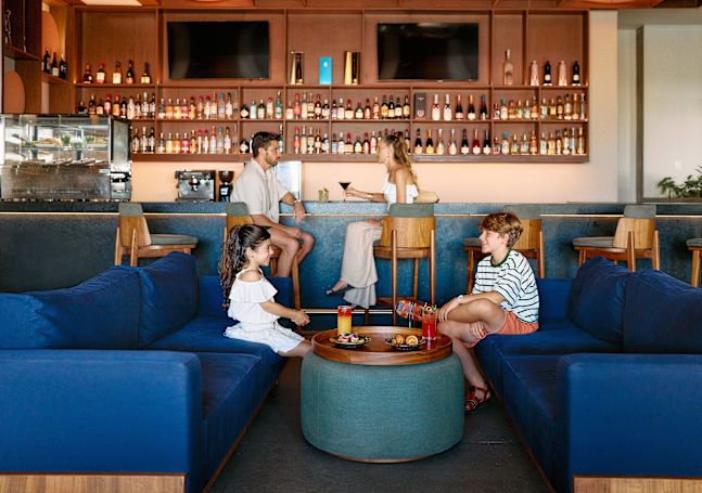 Family hanging out at the Enclave Lounge.