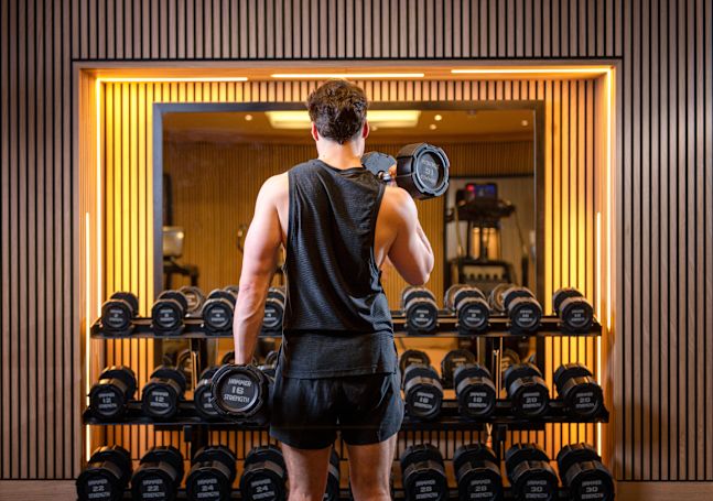 man lifting weights