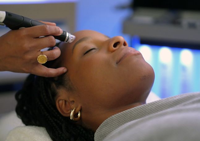 Woman Getting a Facial at Spa Signia