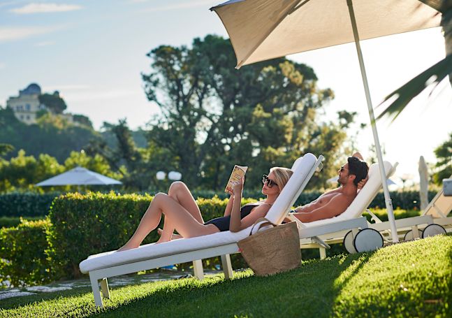 Couple relaxing on loungers