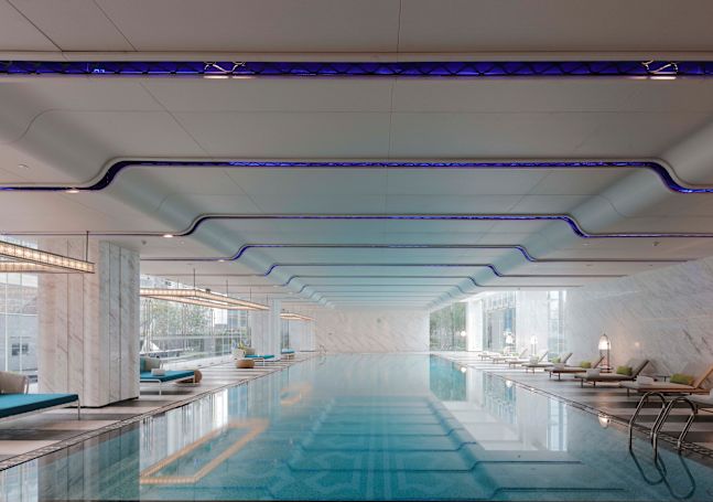 Swimming pool view with loungers