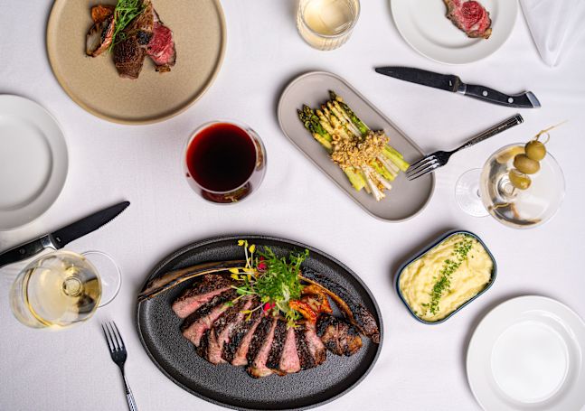 Diplomat Prime restaurant, dinner entrees, cocktails, glasses of wine