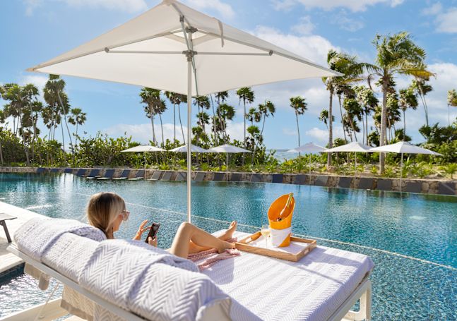 models eating and drinking by the pool