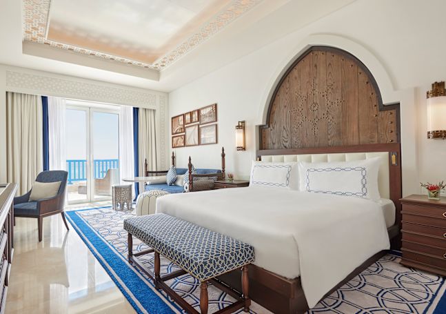 Bed in room with chair