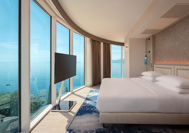Large Bed in Guest Room with HDTV and Panoramic Sea View