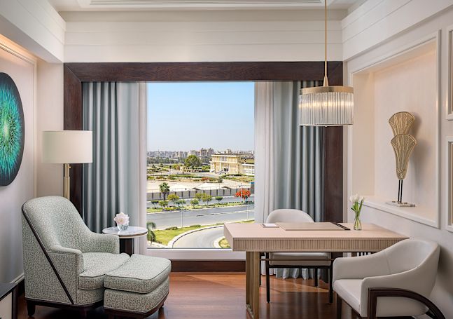 Armchair and Desk Area in a Guest Room with City View