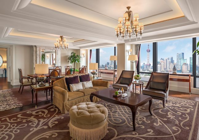 Noble Suite Living Room with City View from Large Windows