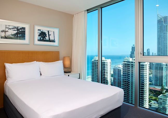 king bed in guestroom with view
