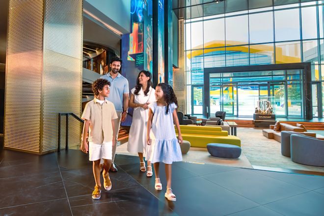Family walking through lobby area with comfortable seating