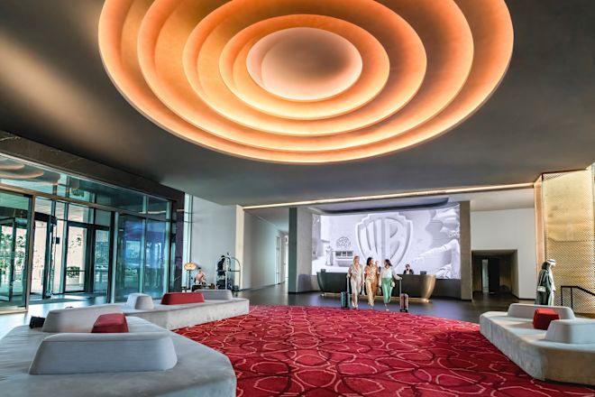 Spacious lobby area with comfortable seating and desk