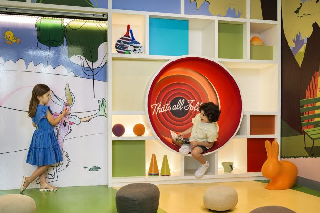 Kids in Looney Tunes themed play area