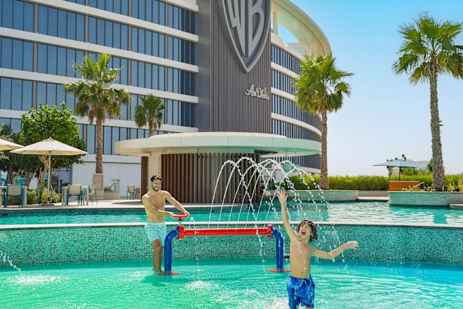 Dad and son playing in water play area