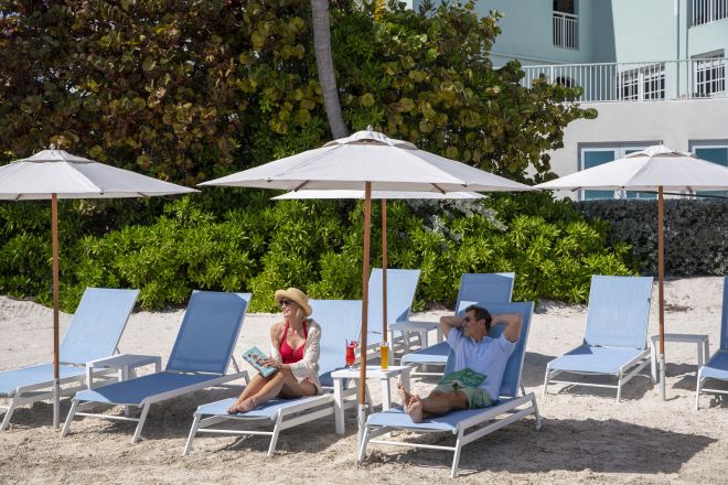 Couple on Beach in Lounge Chairs