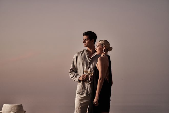 Couple Holding Drinks at Cretamos Restaurant
