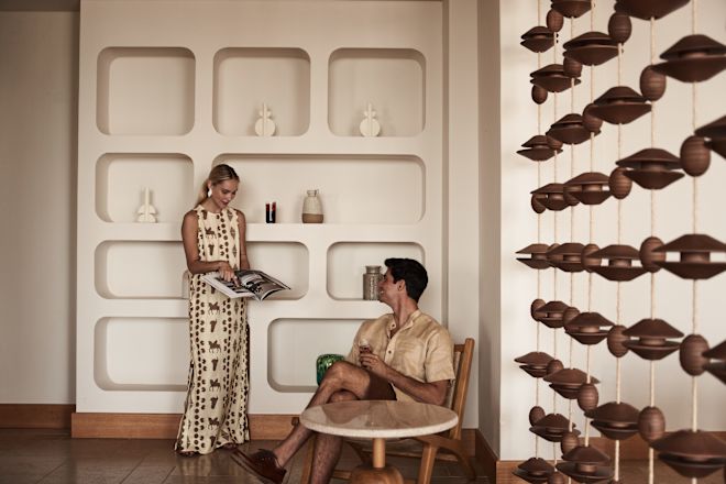 Couple in Lobby Area Reading a Book